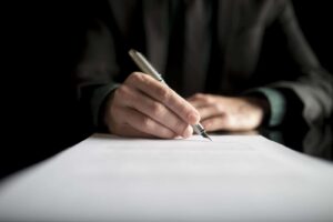 closeup-of-lawyer-or-executive-signing-a-contract-PK4B783_resized